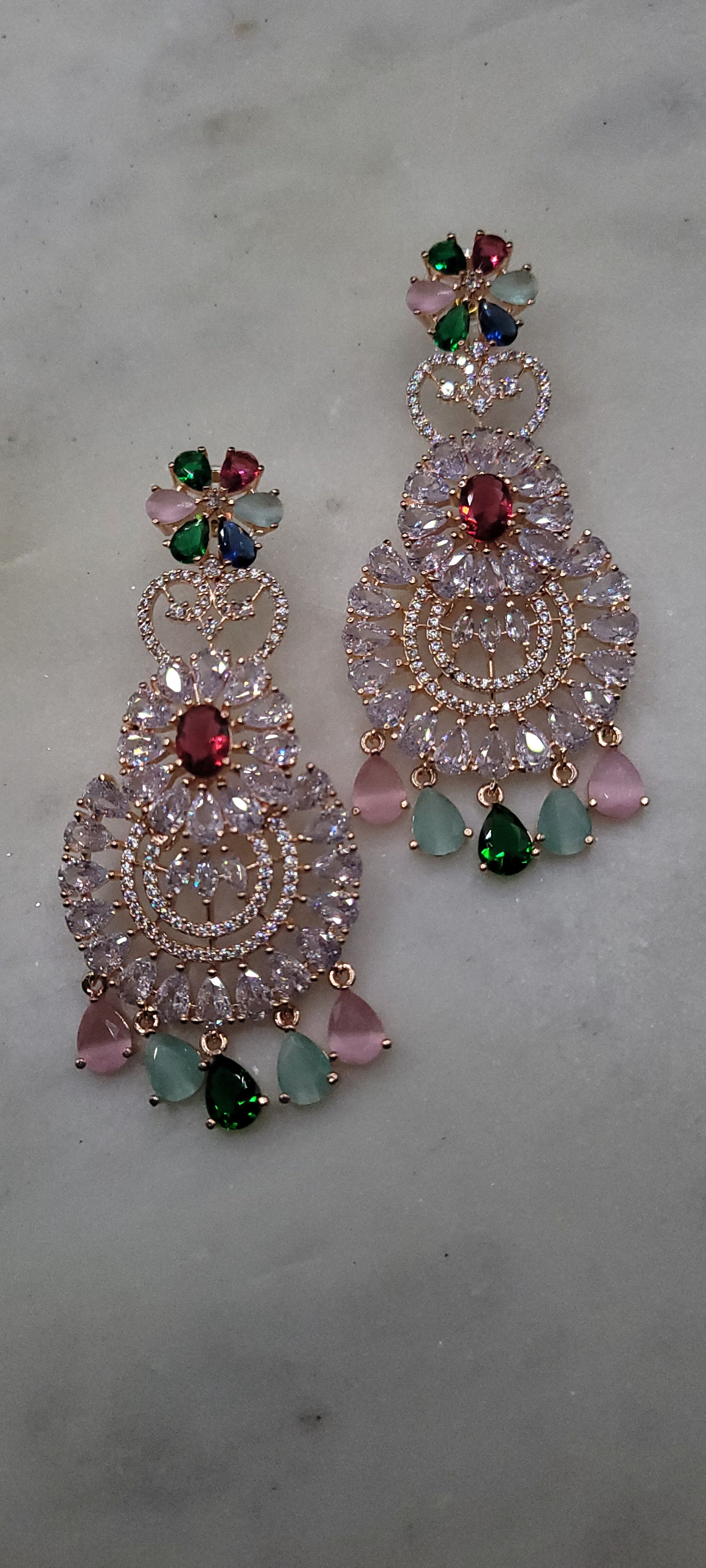 Fabulous colored diamond earrings in rose gold tone