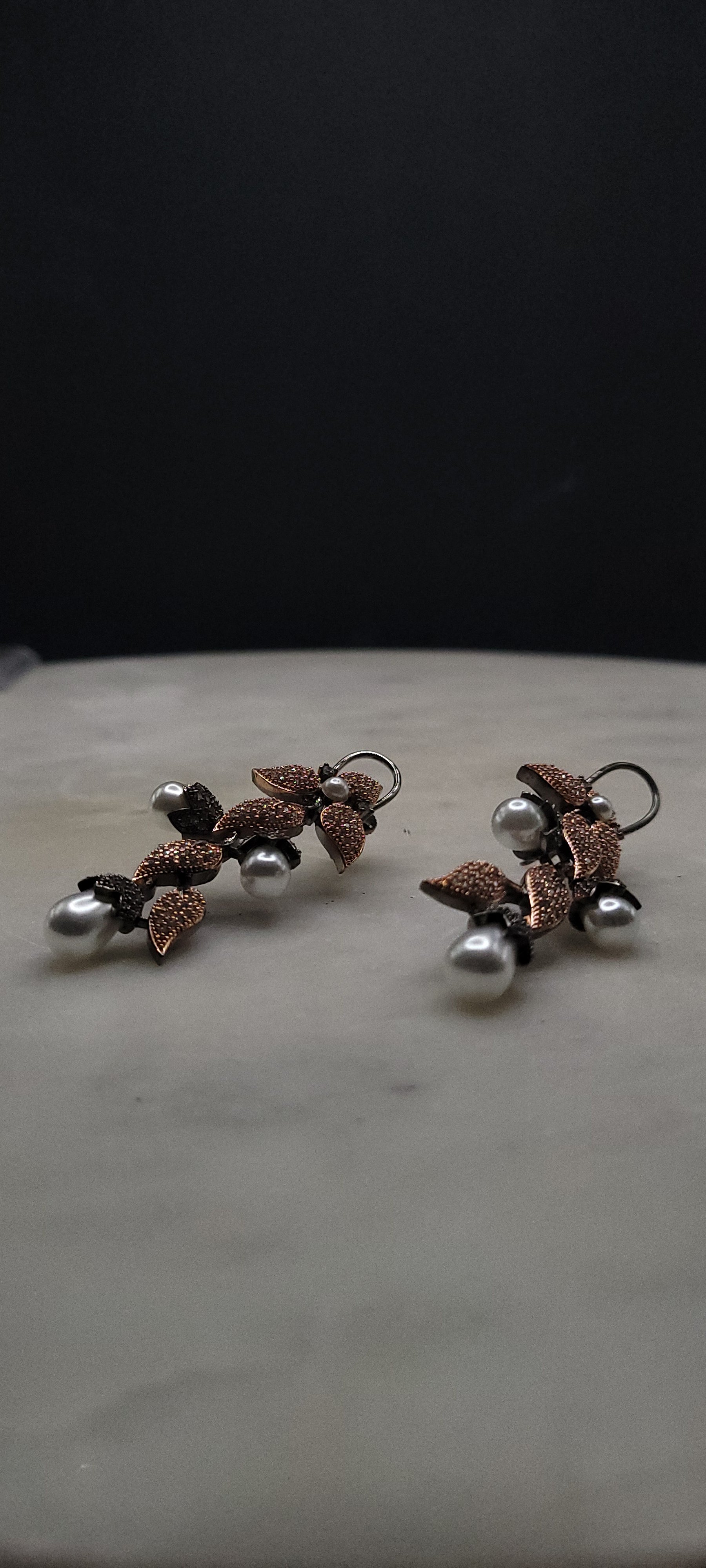 Unique design two toned earrings with pearls