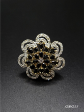 FLORAL DIAMOND IN GOLD TONE WITH BLACK STONES