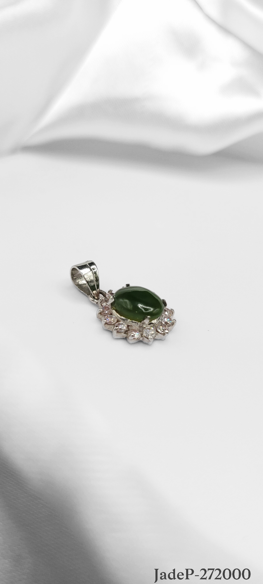 Jade stone encrusted with zirconia diamonds on sterling silver