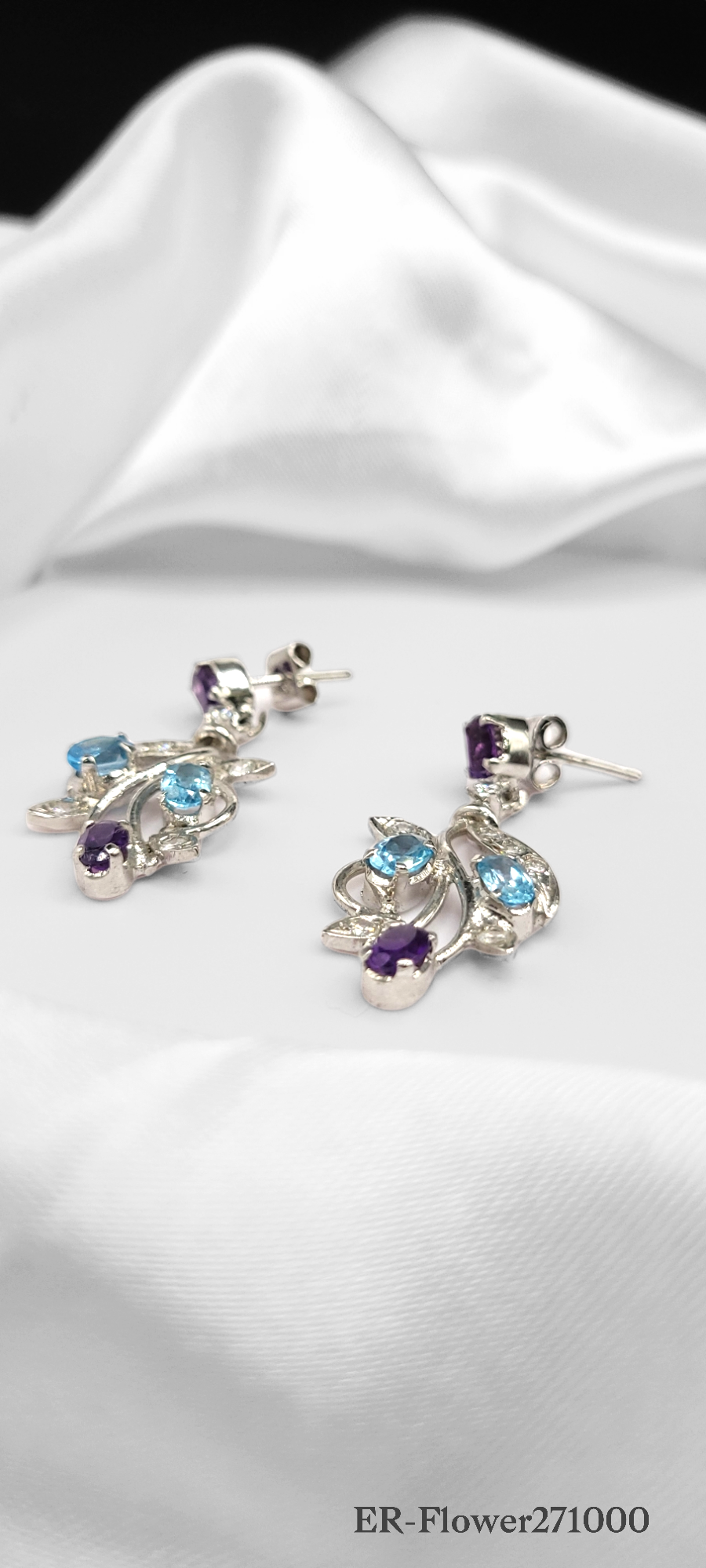 BEAUTIFUL FLOWER DESIGN EARRINGS ON STERLING SILVER ENCRUSTED WITH AMETHYST, CZ AND BLUE TOPAZ STONES. ONE OF A KIND.
