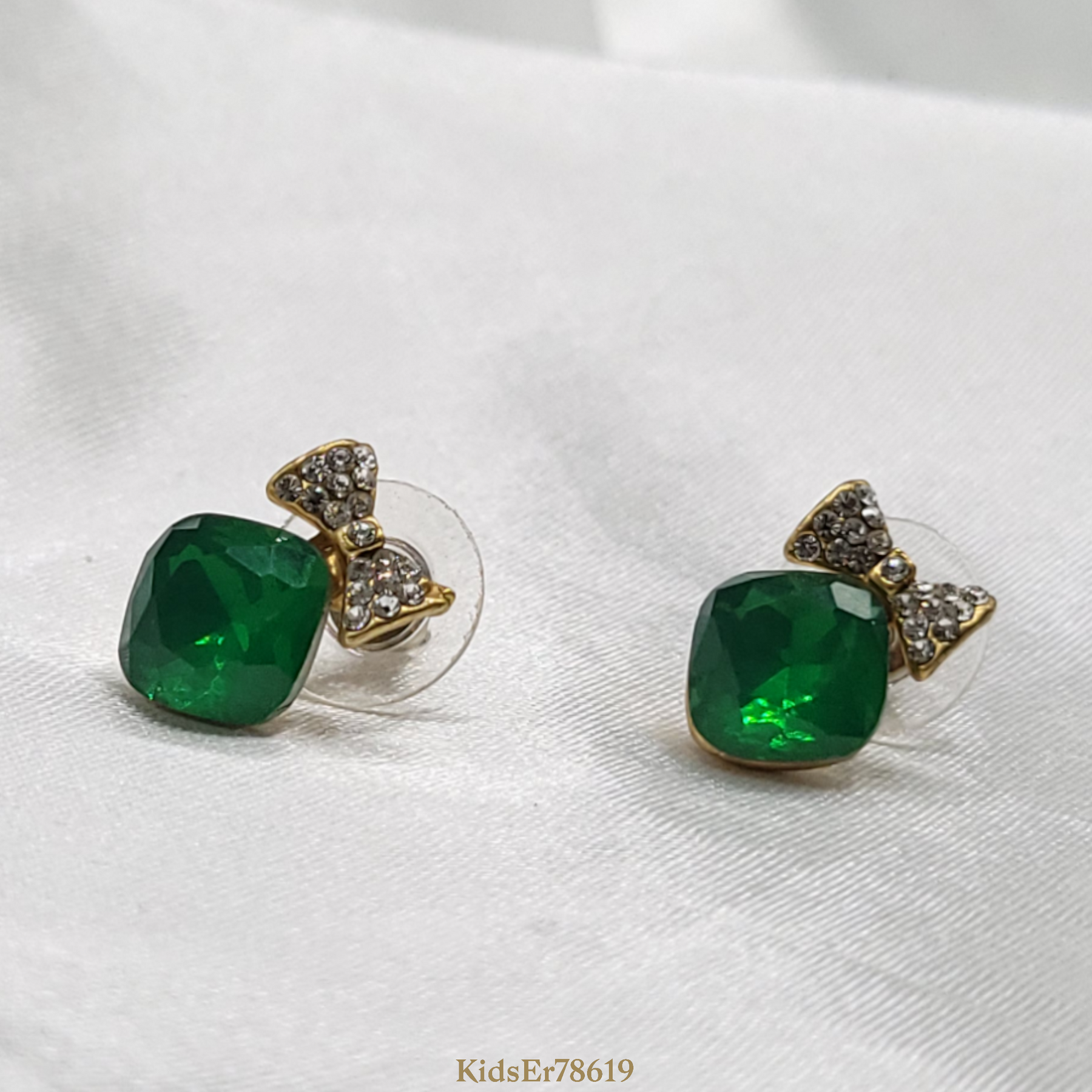 Emerald green earrings with diamond bow